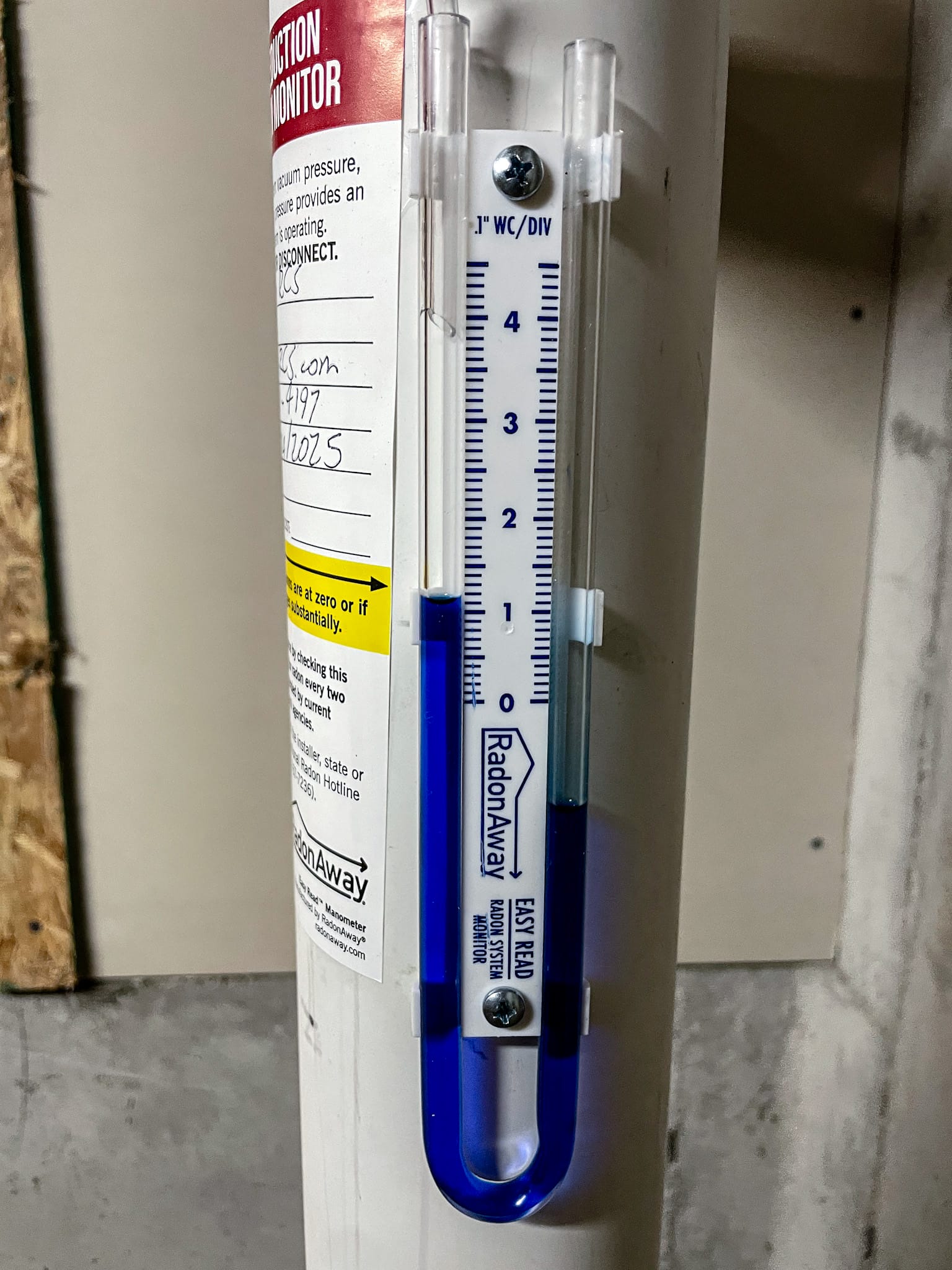 Radon mitigation system with activated radon fan in a residential basement